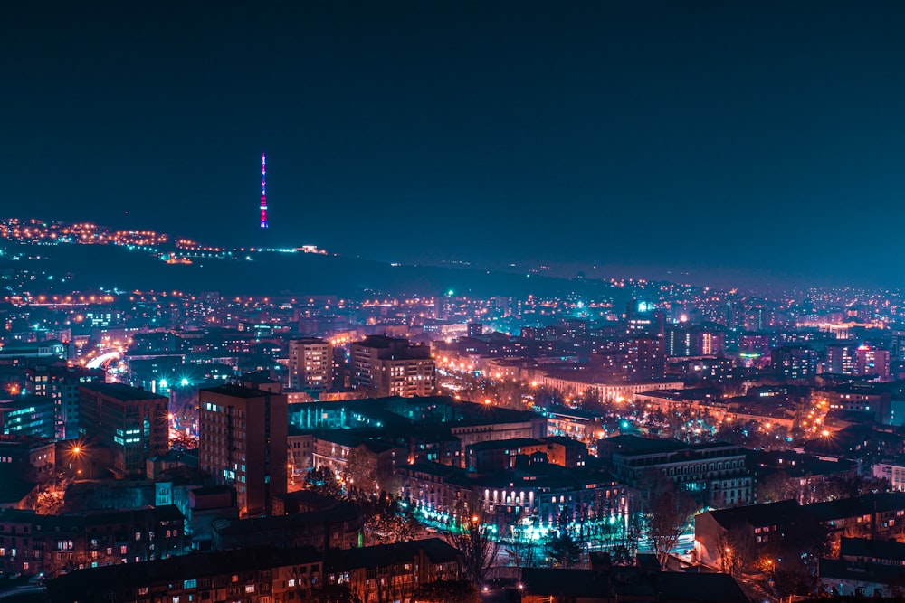 city with high rise buildings during night time