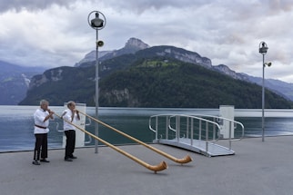 a couple of people that are playing trombone