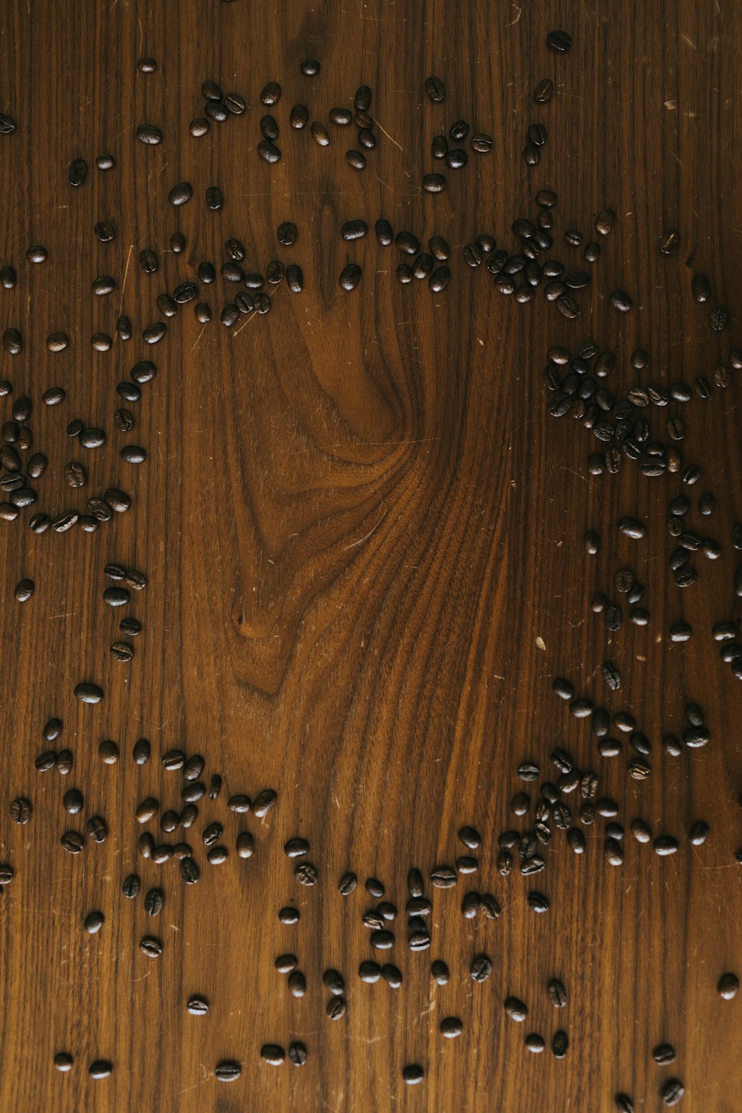 black and brown beads on brown wooden table