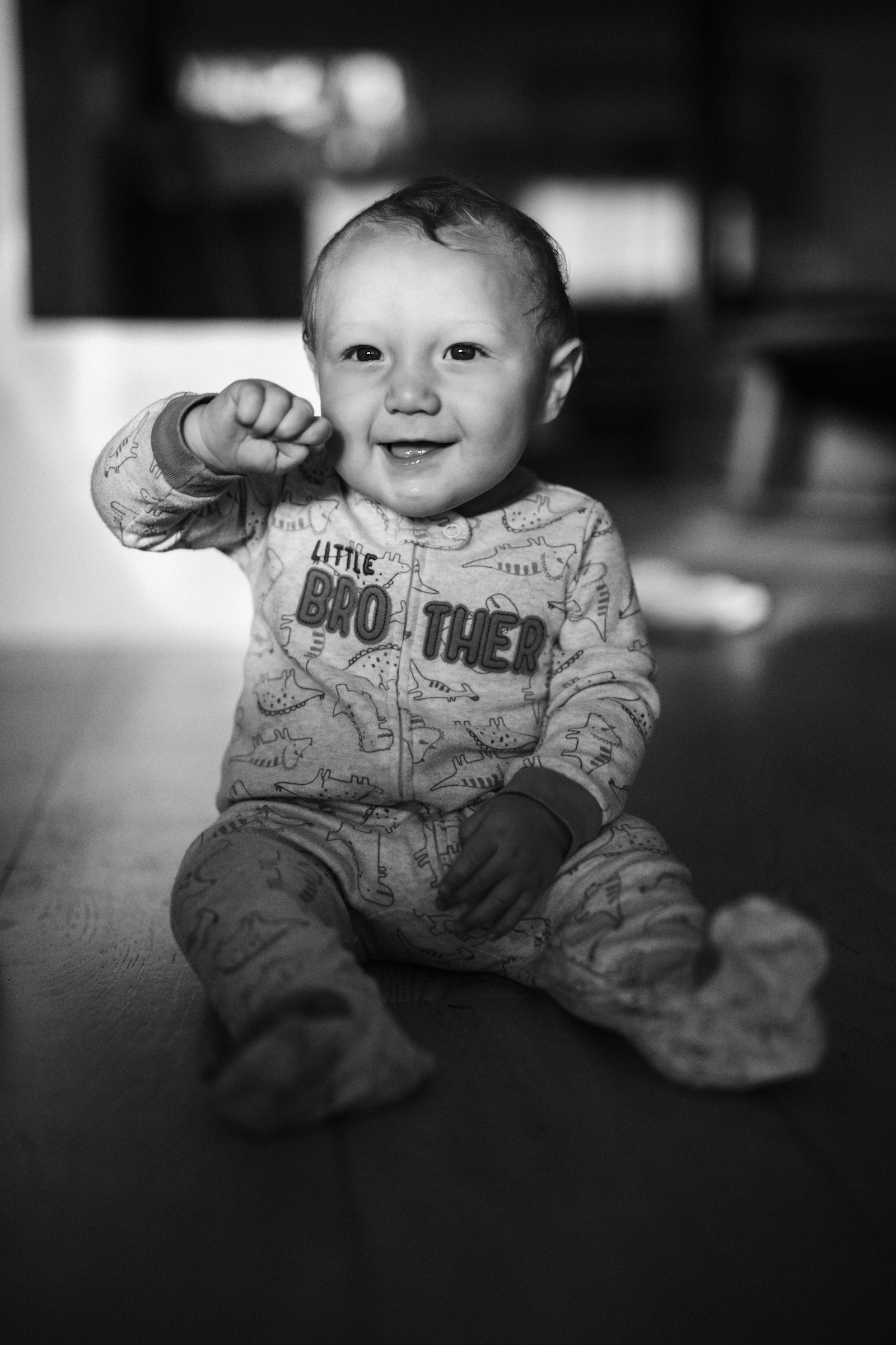 Tokina Opera 50mm F1.4 FF sample photo. Grayscale photo of baby photography