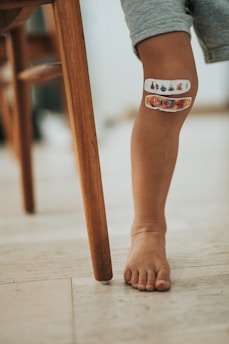 person wearing orange and white cat tattoo