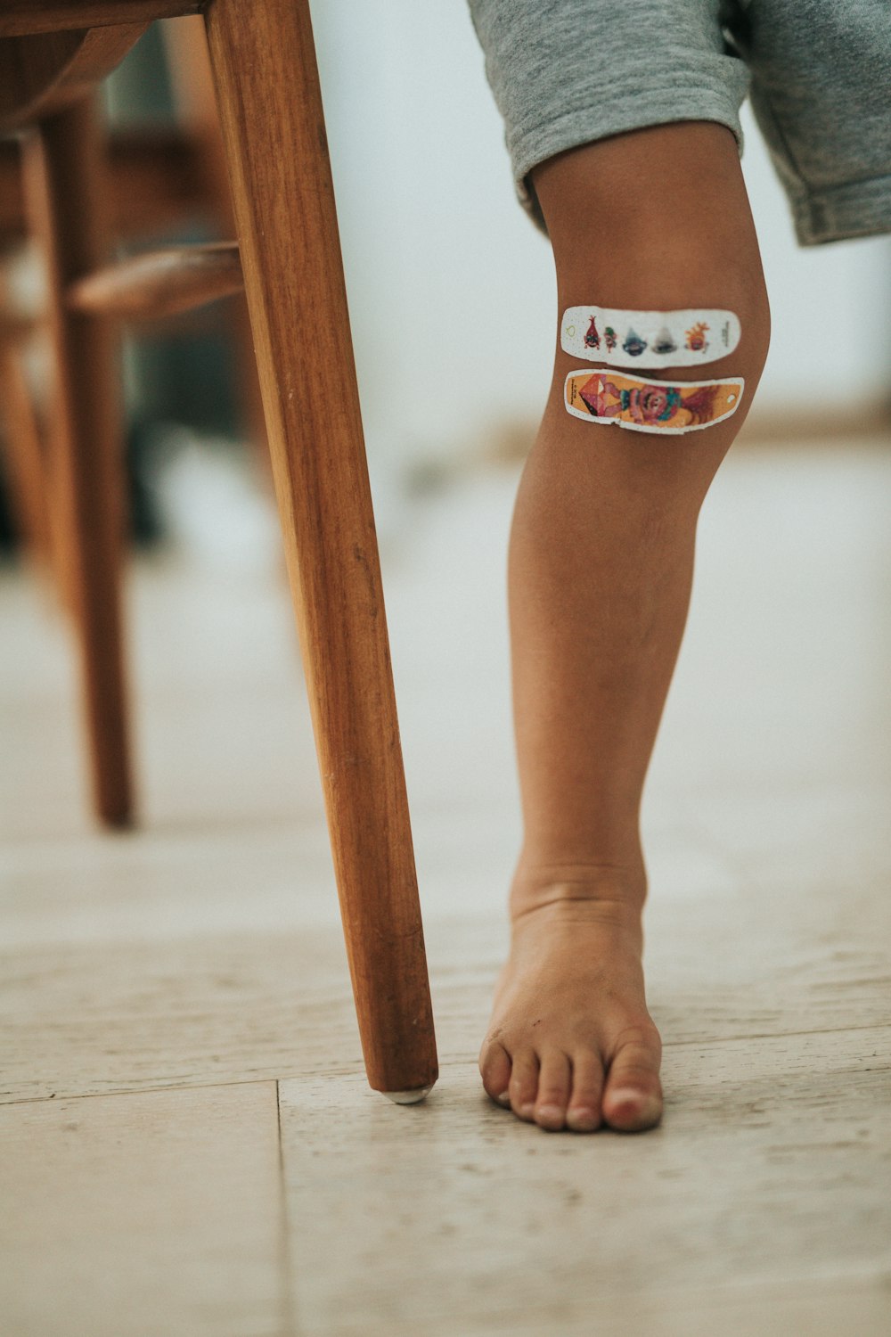 person wearing orange and white cat tattoo