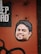 A sticker of a smiling man's face is placed on a textured, rusty orange surface. Above the sticker, part of a black and white printed text is visible, with the letters 'EP DAD'. The background has a rough, industrial look with visible bolt holes and faded black paint strokes across the bottom left corner.