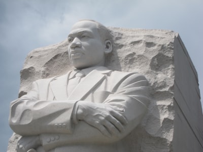 man in robe statue during daytime martin luther king zoom background