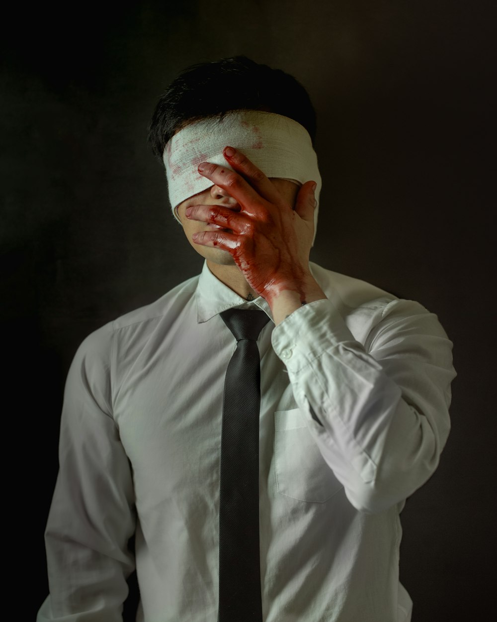 man in white dress shirt and black necktie