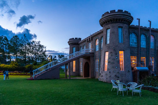 Elegant stone castle entrance with warm lighting at dusk, symbolizing trust and heritage.
