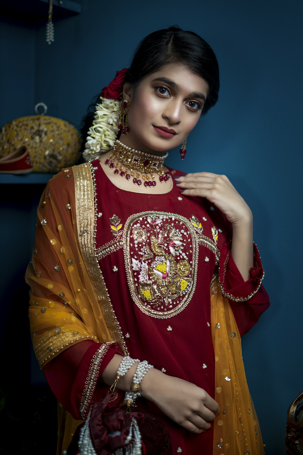 woman in red and gold sari