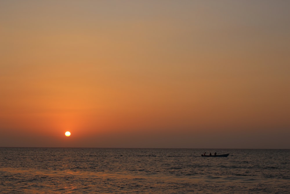 body of water during sunset