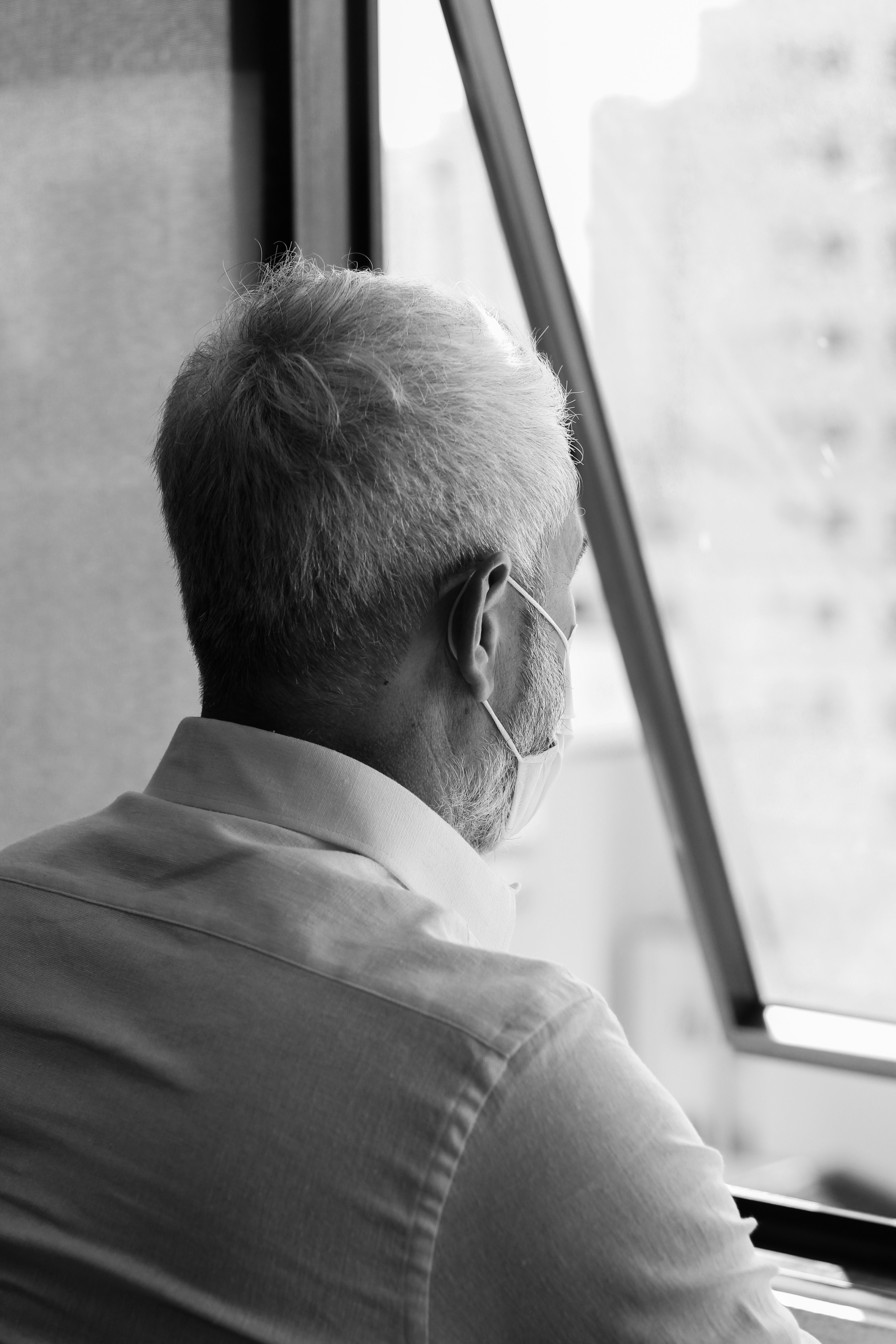 man in white dress shirt wearing black framed eyeglasses