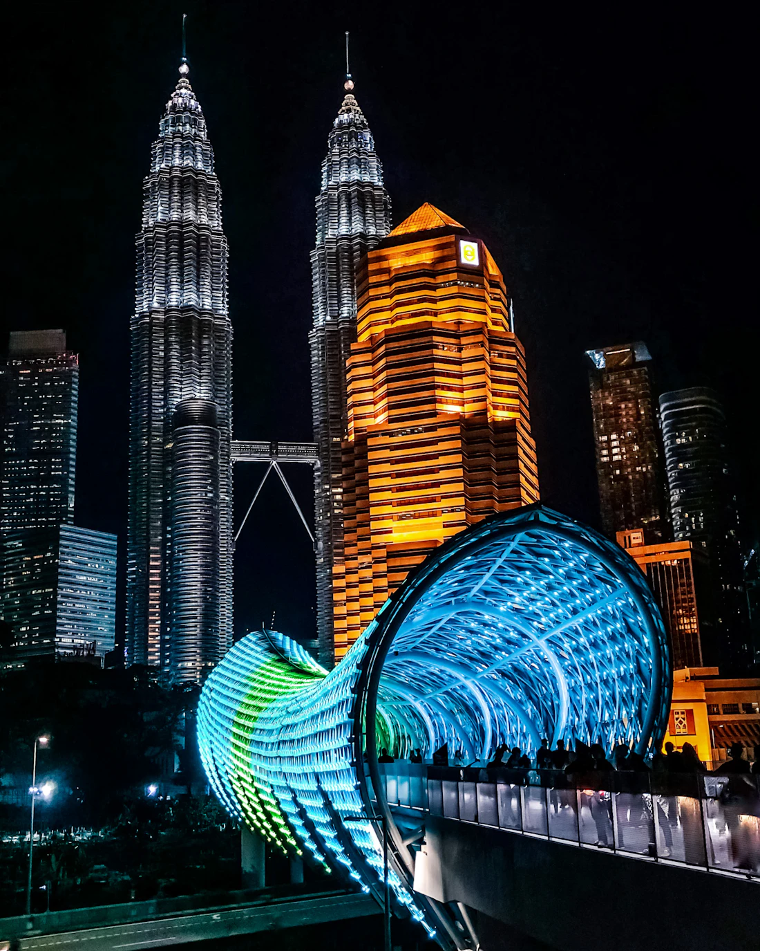 Saloma link bridge in Kuala Lumpur glowing at night