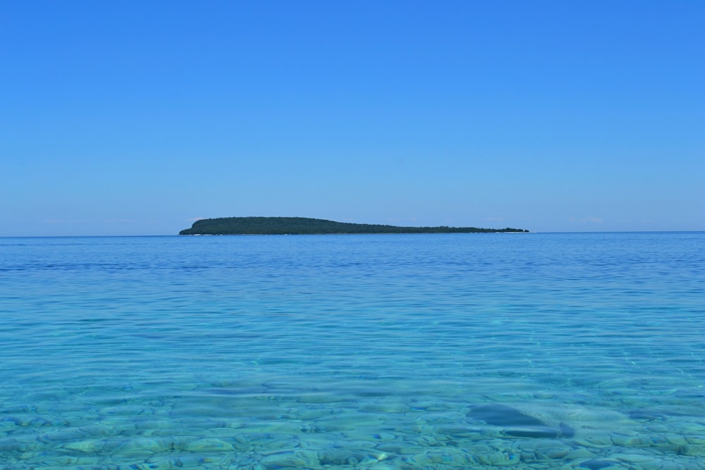 blue sea under blue sky during daytime