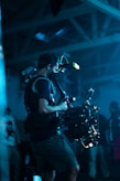 man in black t-shirt playing drum set
