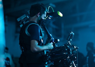 man in black t-shirt playing drum set