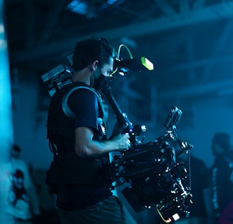 man in black t-shirt playing drum set