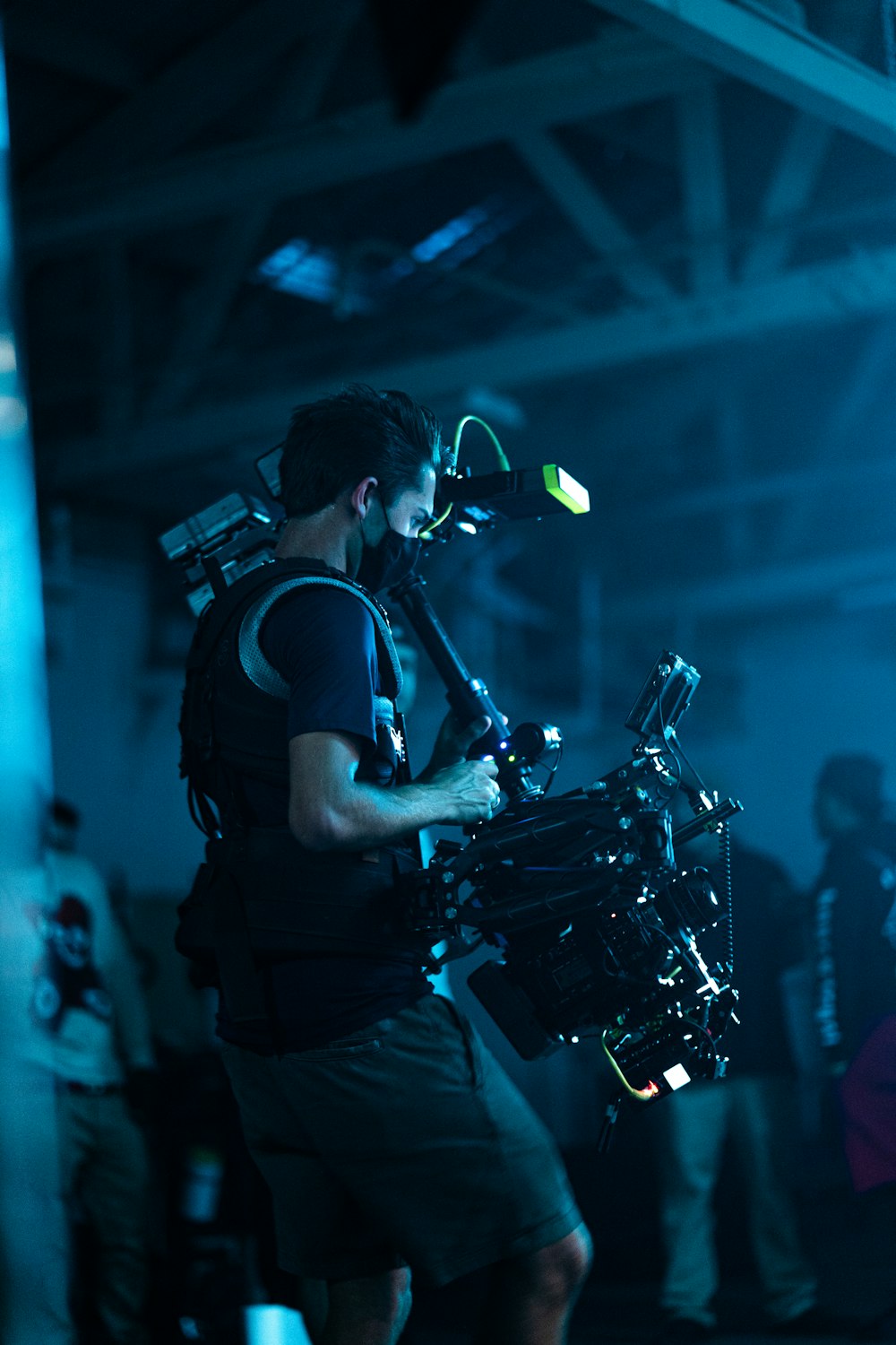 man in black t-shirt playing drum set