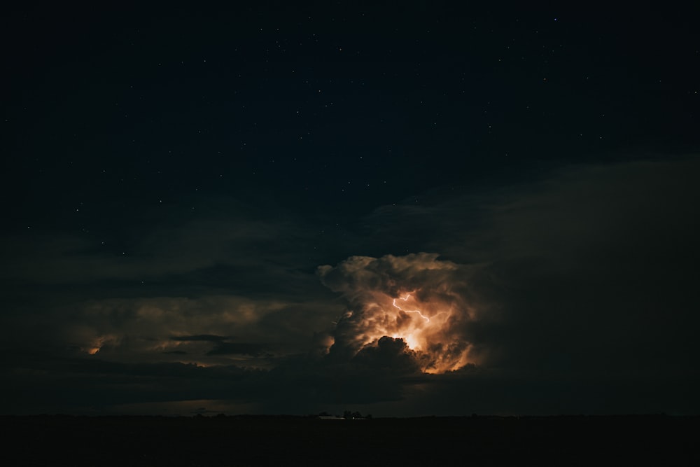 white clouds and black sky