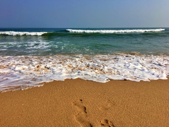 sea waves crashing on shore during daytime in Yarada India