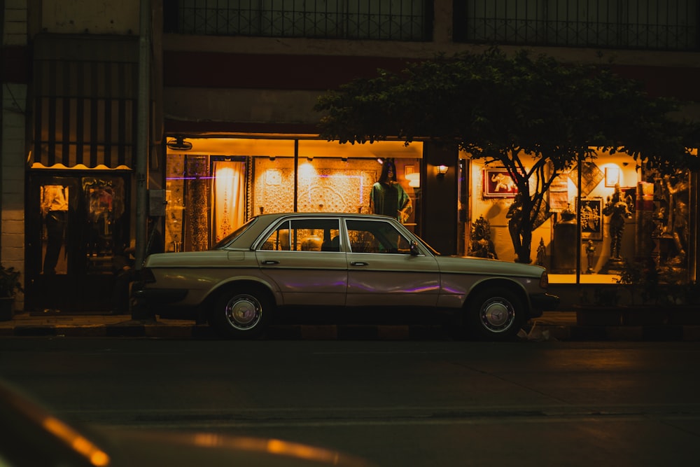 purple sedan on road during night time