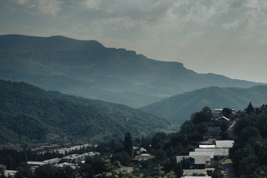 green mountains under white clouds during daytime in Dilijan Armenia