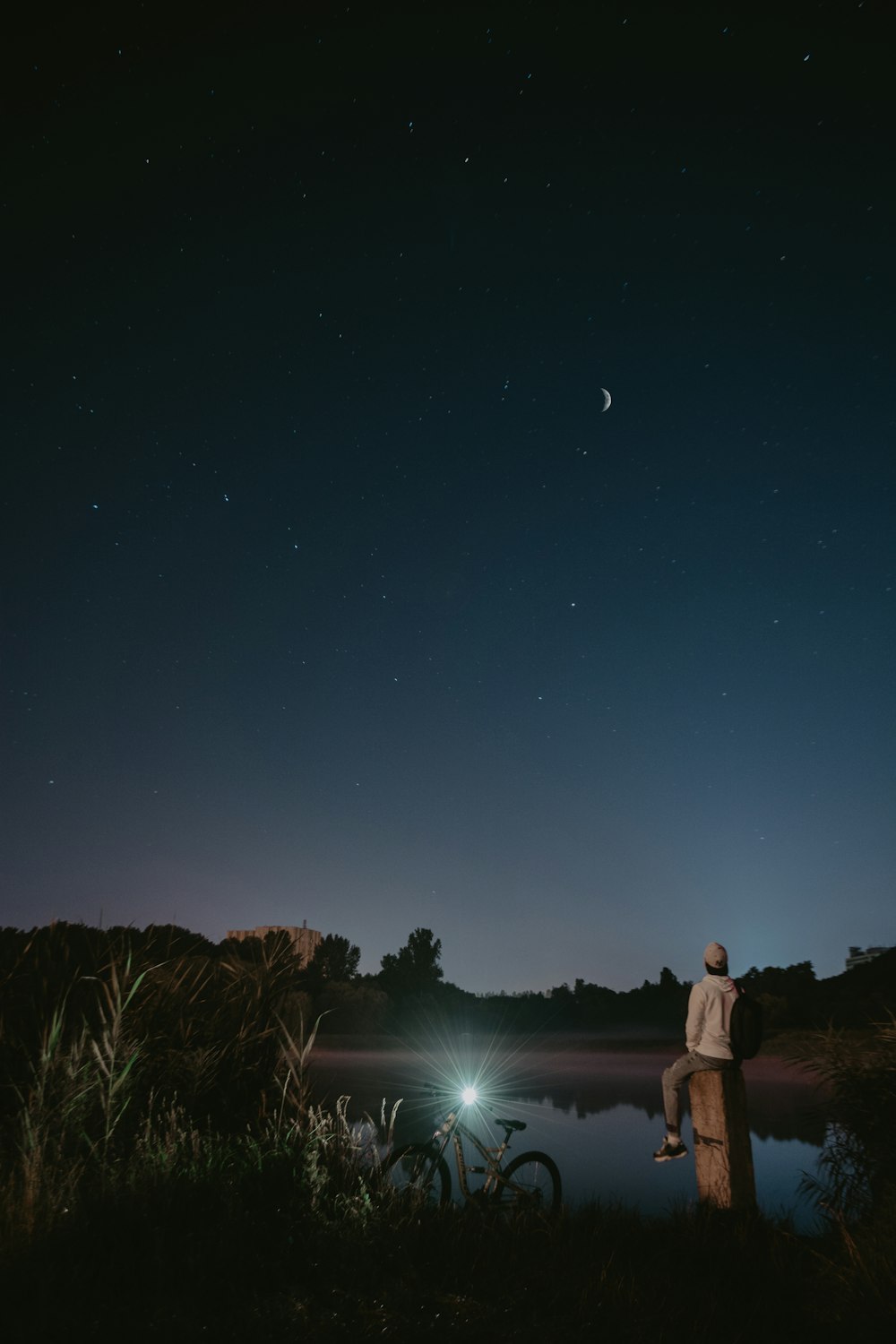 man and woman standing on grass field during night time