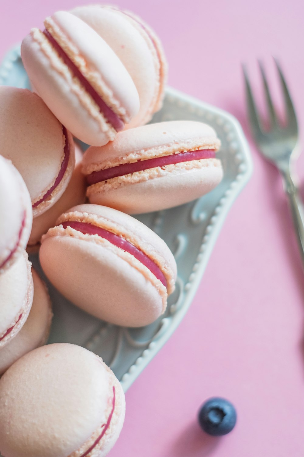 white and pink cupcakes on white ceramic plate