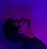 An eye-catching portfolio site for a photographer, with bold purple highlights and dynamic image grids.