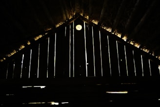 Interior view of a tiny solar house showing a bright living area with natural wood finishes and solar-powered lighting.