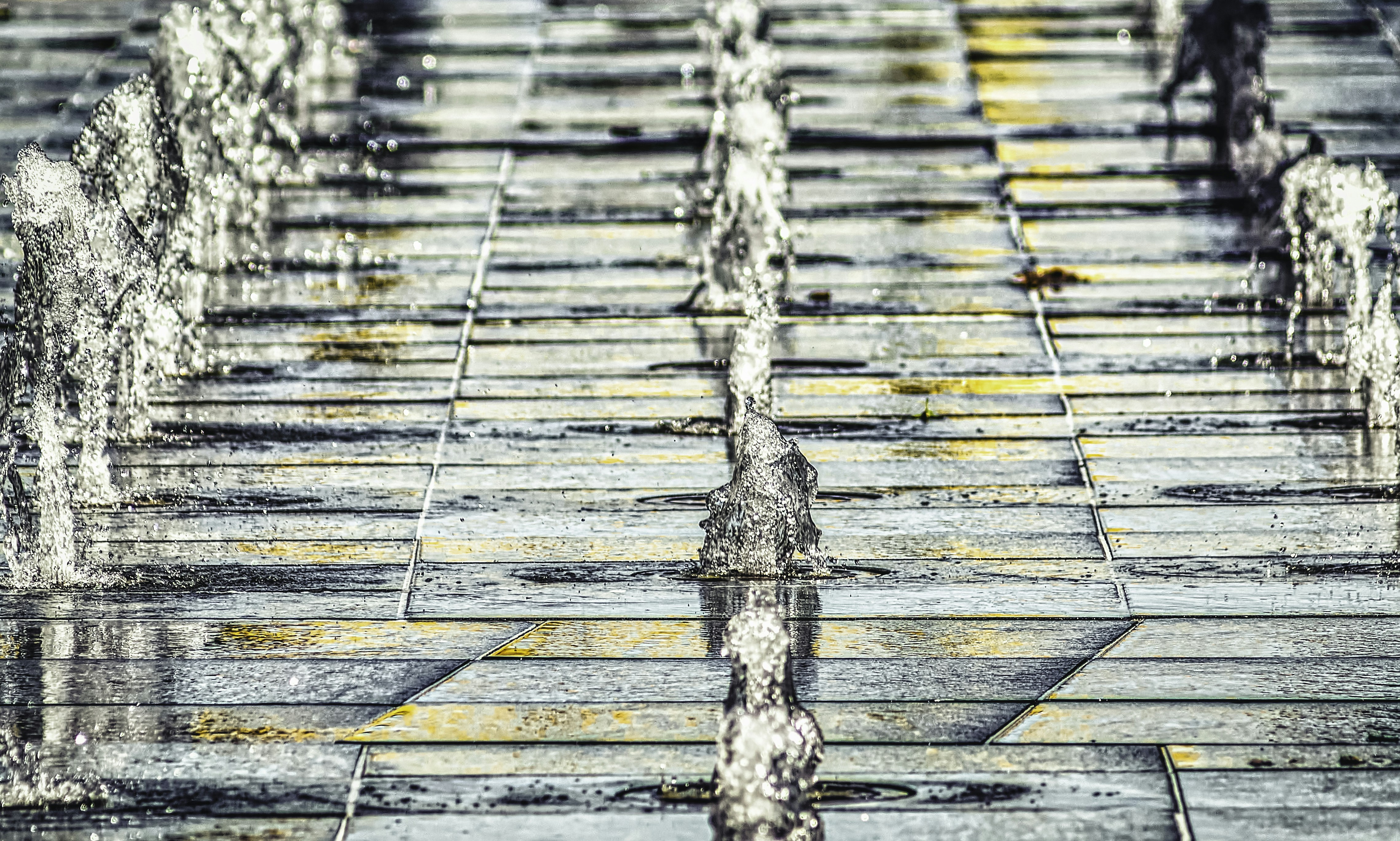water falling on brown wooden floor