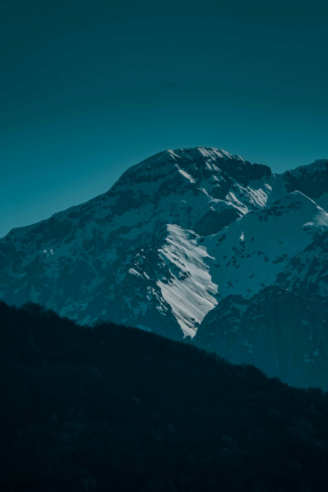 snow covered mountain under blue sky during daytime