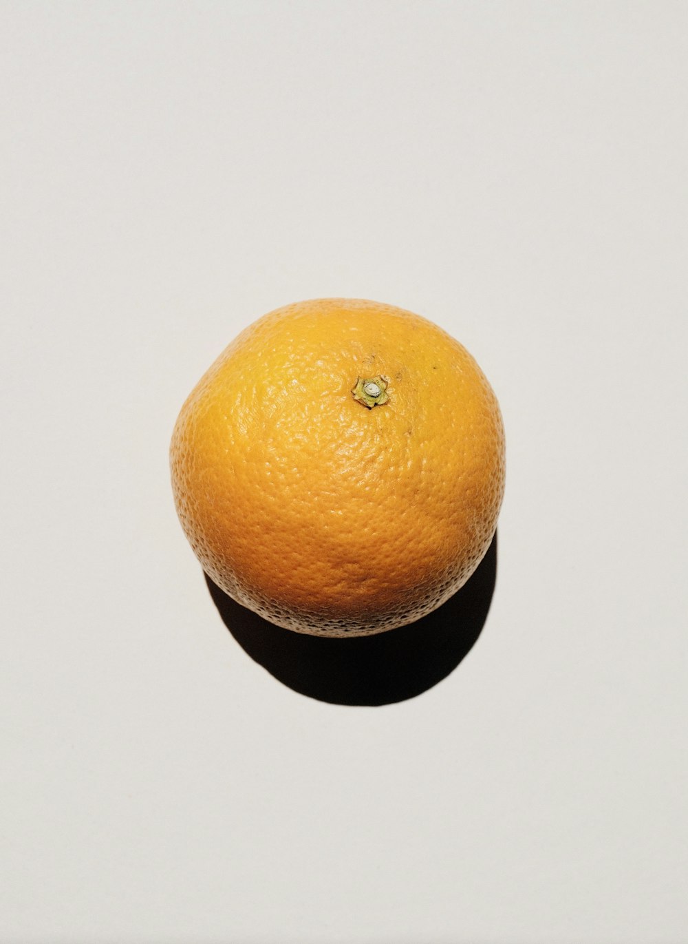 orange fruit on white table