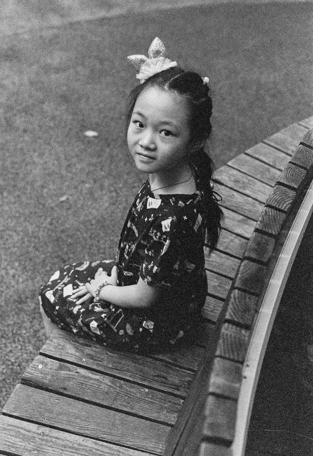 grayscale photo of girl in black and white floral dress