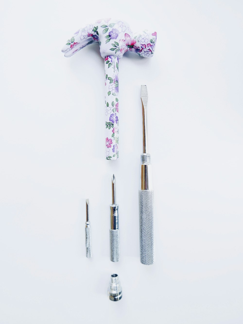 white and purple toothbrush on white surface