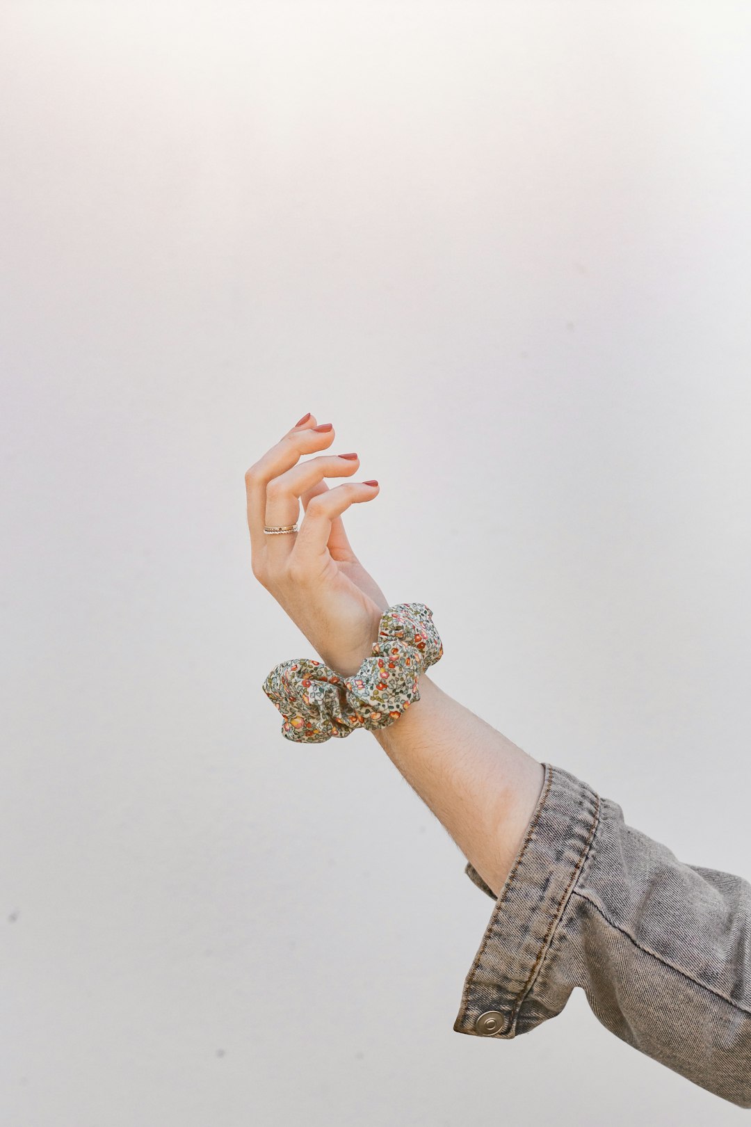 person wearing gold and diamond ring