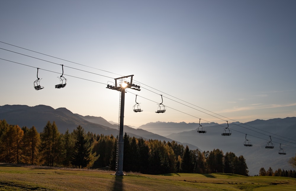 cable cars over the mountains during daytime