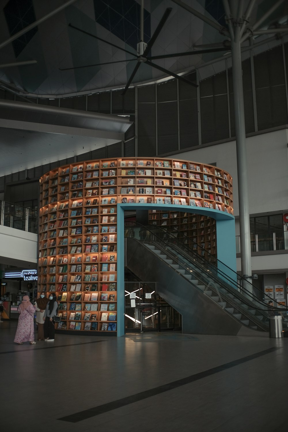 people walking on hallway inside building