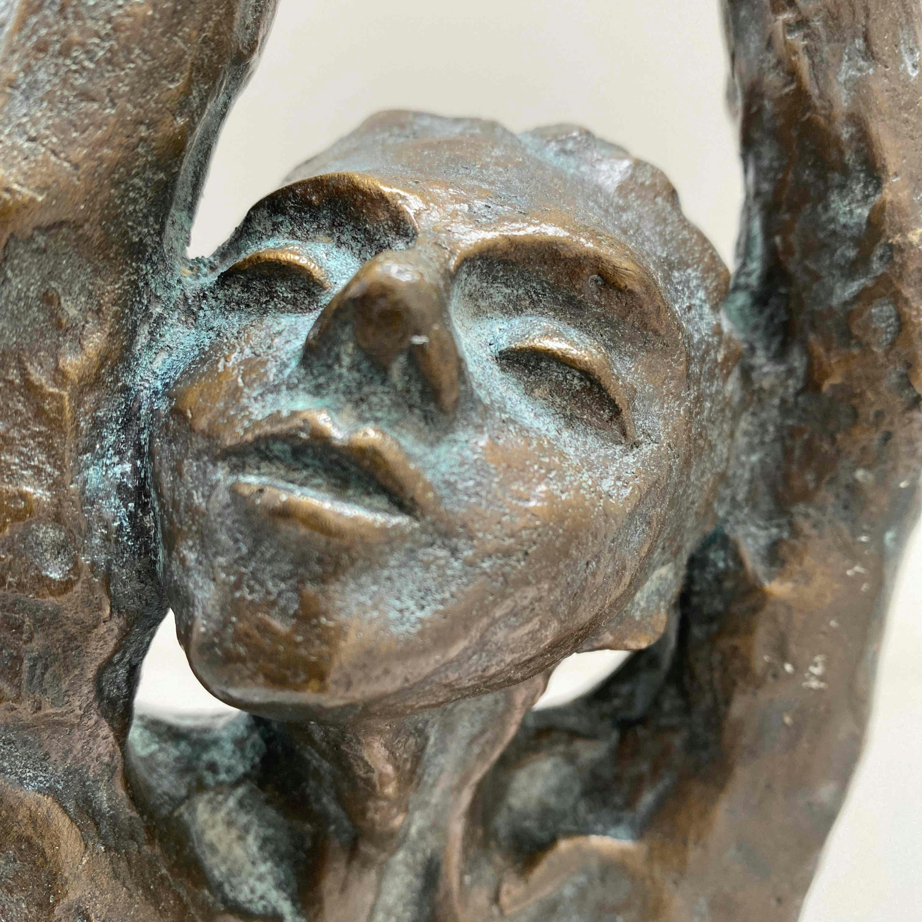 Bronze sculpture in museum, detailed metalwork showing artistic craftsmanship and patina