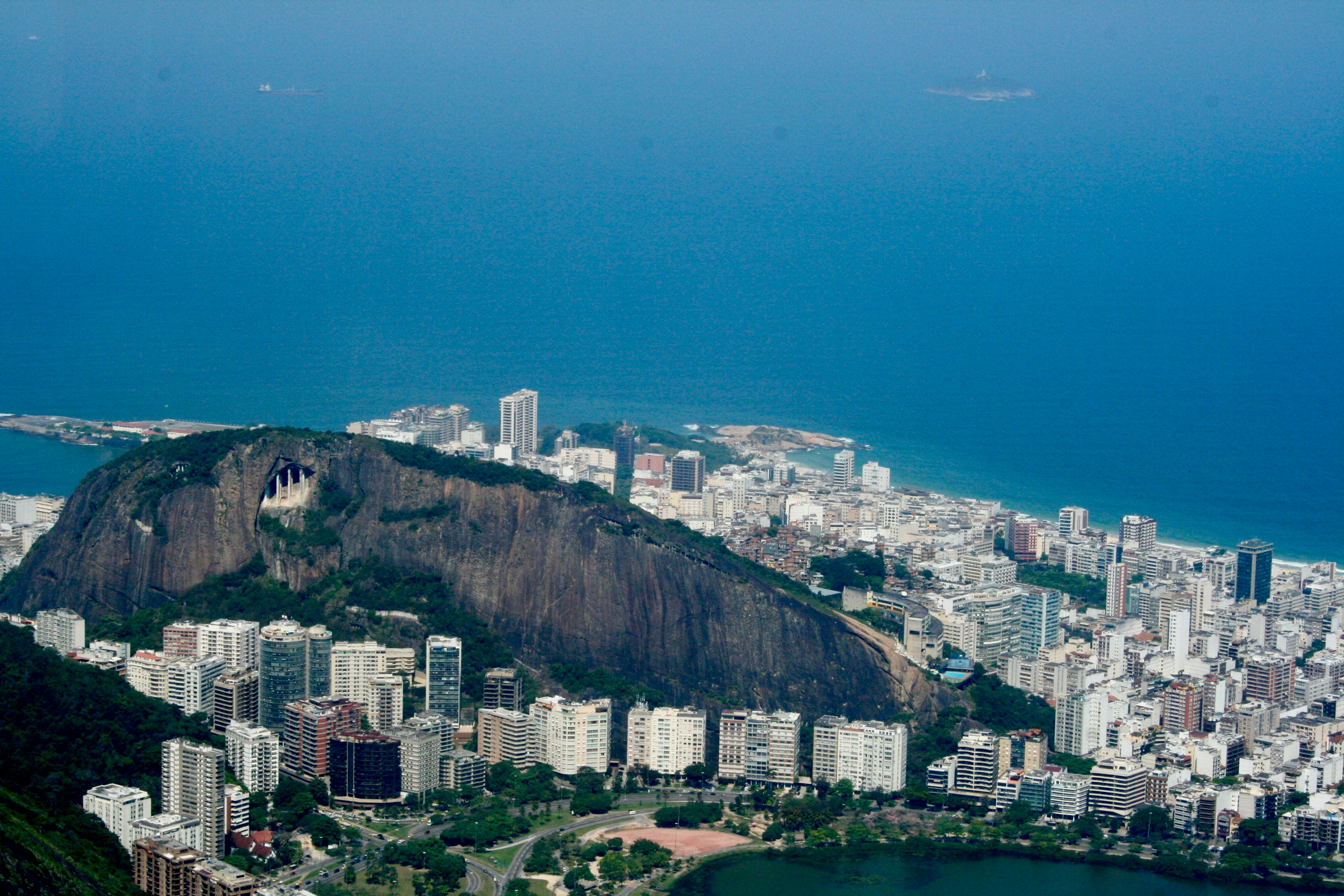 aerial view of city buildings near body of water during daytime