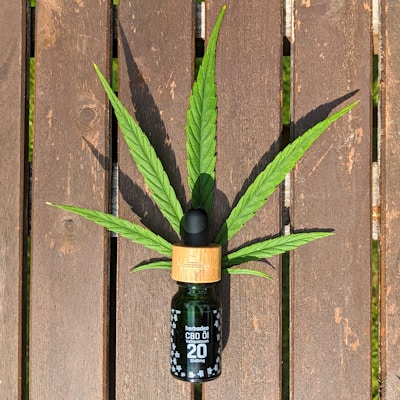 Handcrafted CBD oils in elegant dropper bottles with natural ingredients in the background.