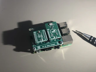 Charging boards displayed on a light blue background with tools nearby.