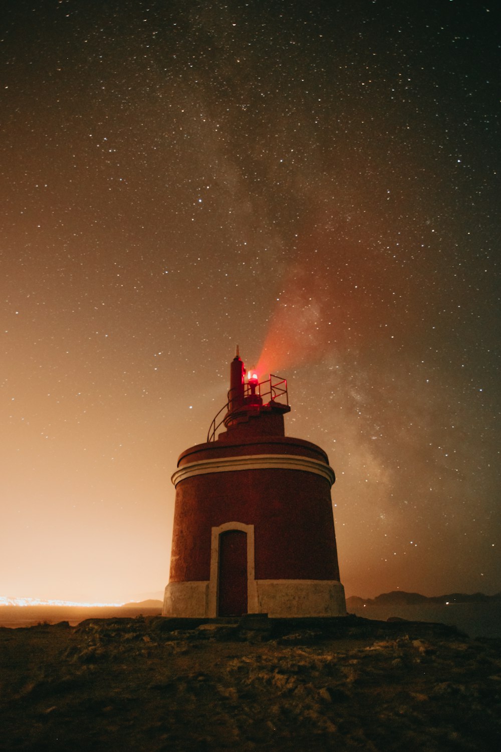 brown concrete tower under starry night