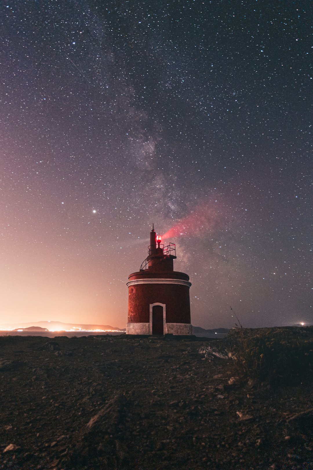 brown concrete tower under starry night