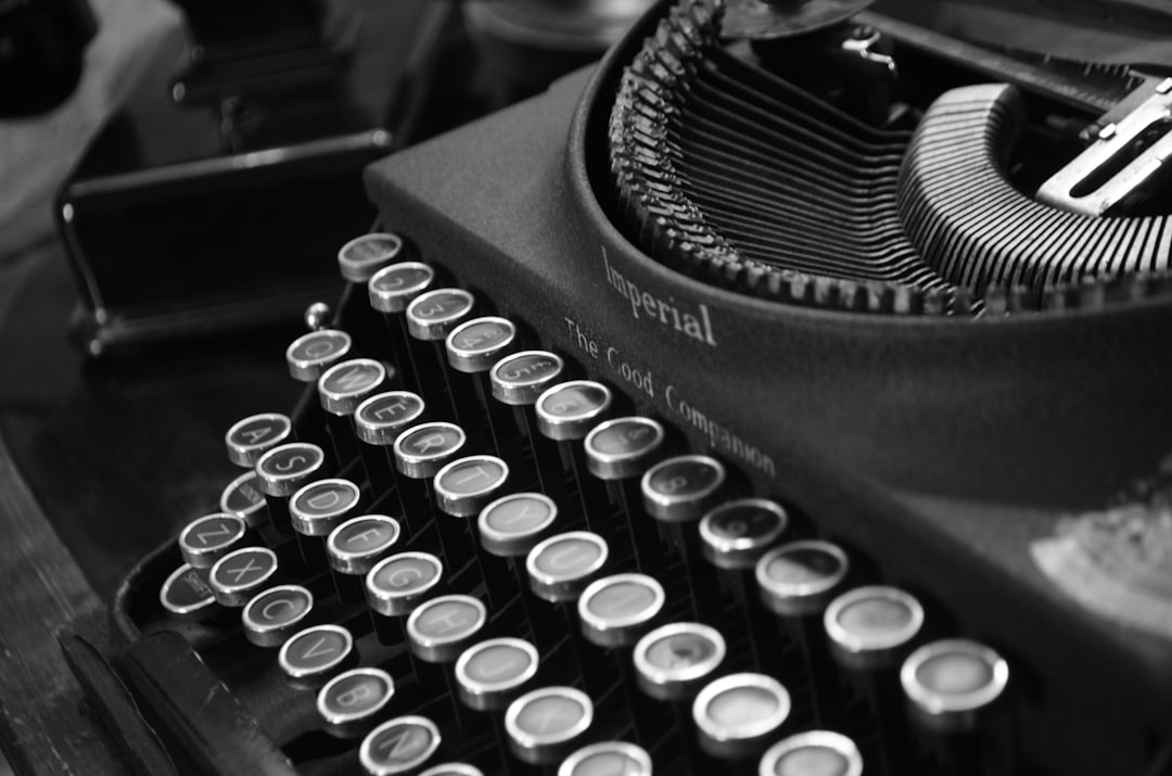 black and white typewriter on black table