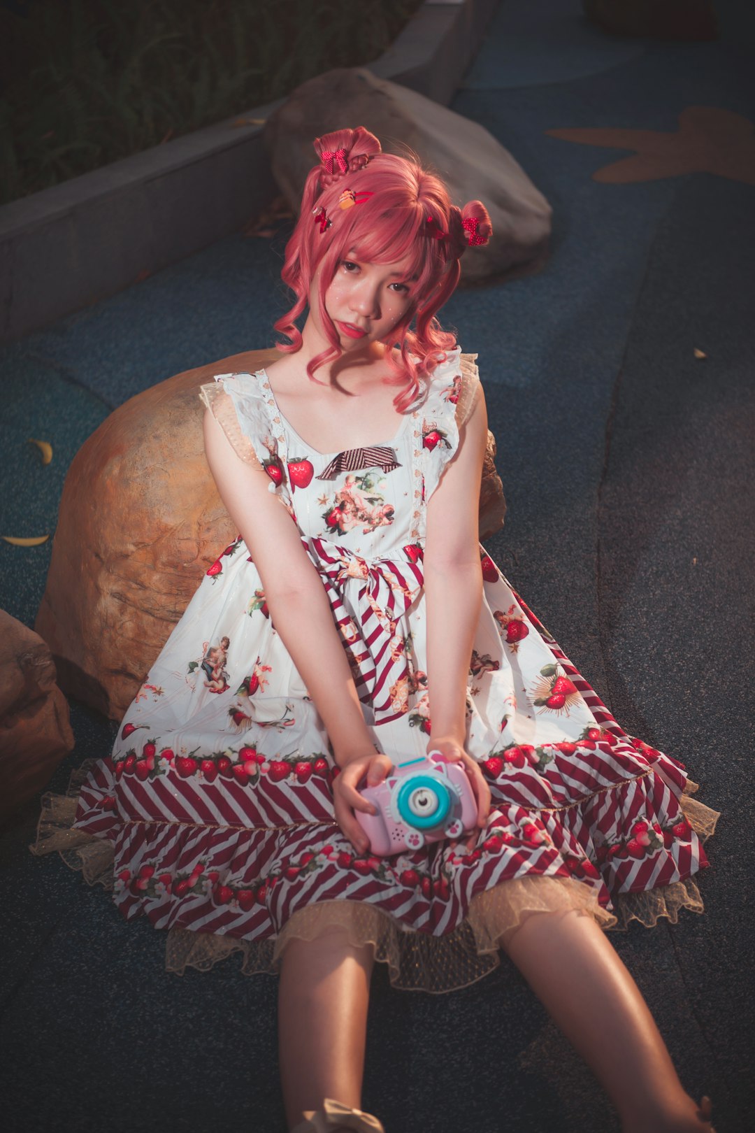 pink haired girl doll on black textile