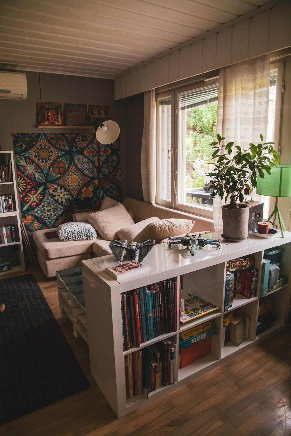 books on white wooden shelf