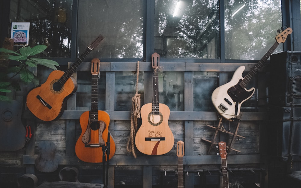 brown and white acoustic guitars