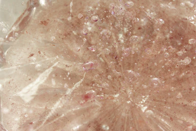 Close-up image of a translucent scientific layer showing fluid dynamics flowing through nanoporous membranes.
