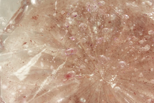 Close-up image of a smooth, translucent zinc oxide thin film on a glass substrate.