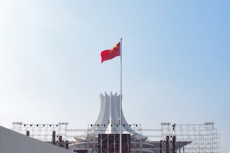 red white and blue flag on pole during daytime