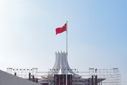red white and blue flag on pole during daytime
