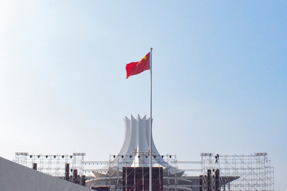 red white and blue flag on pole during daytime